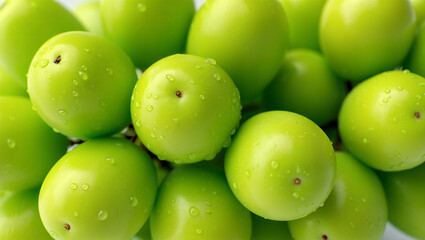 Close-up of fresh green grapes with water droplets on a white background fruit healthy