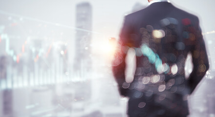 Businessman back view with cityscape and financial graph overlay business concept.