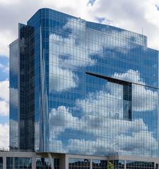 Modern Glass Skyscraper Reflecting Cloudscape