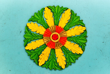 Colorful Floral-Like Decorative Design With Green, Yellow, and Red Pattern