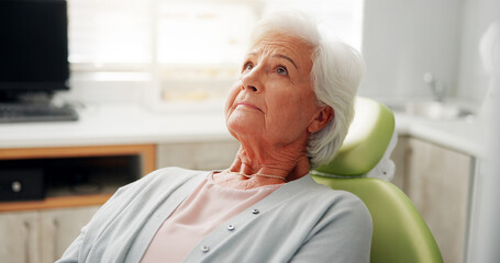 Fototapeta premium Dentist chair, health and nervous senior woman with appointment, oral hygiene or root canal. Orthodontics, fear and patient waiting in clinic for dental wellness, toothache or treatment in retirement