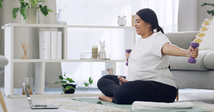 Woman, dumbbells and laptop in lounge for fitness, online tutorial or wellness video for muscle. Strength exercise, equipment and tech for weightlifting routine with virtual physical training in home