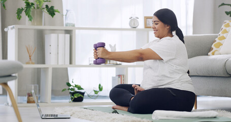 Laptop, dumbbells and exercise with plus size woman in home for online class, virtual workout and health. Weight loss, streaming fitness routine and wellness with person in living room of house