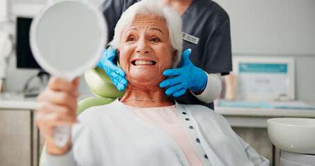 Dentist, senior woman and happy with mirror for tooth cleaning results, dental implant or filling. Retirement, healthcare or doctor with elderly patient in clinic for dentures or root canal treatment