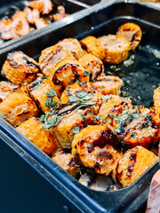Grilled corn on the cob served at a summer street food festival