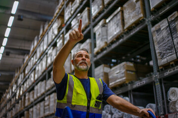 Logistics employee is working warehouse.