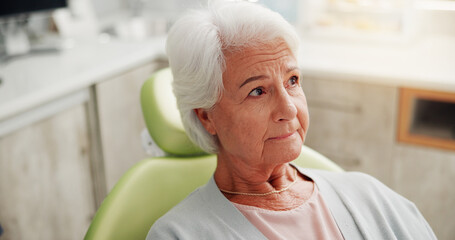 Checkup, oral hygiene or senior woman in clinic with toothache, thinking or worry in consultation. Healthcare, patient or nervous in dentist office with thoughts, cosmetic or treatment in retirement.