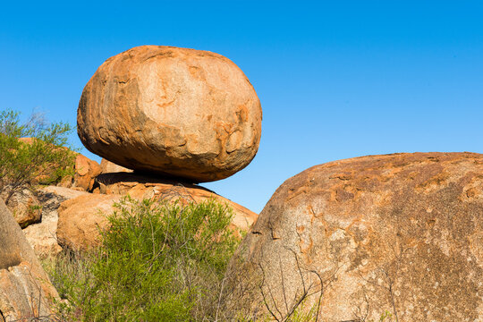 Large granite boulder balanced on another rock at Devils Marbles.