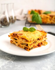Fototapeta premium Creamy lasagna slice on plate