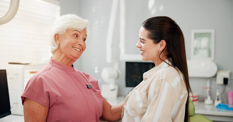 Obraz premium Smile, dentist and woman in consultation for dental health, oral hygiene and appointment. Orthodontics, happy patient and professional with conversation for teeth care, support and wellness in clinic