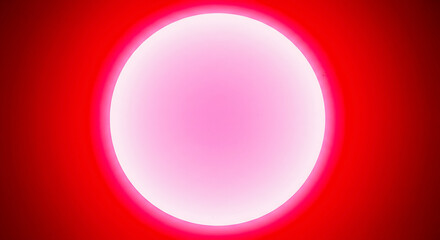 Obraz premium Abstract glowing red orb with a bright pink center on a solid red background, representing energy and light