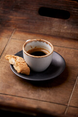 Cup of coffee on rustic wooden background. Soft focus. Copy space	