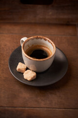 Cup of coffee on rustic wooden background. Soft focus. Copy space	