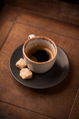 Cup of coffee on rustic wooden background. Soft focus. Copy space	