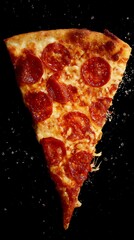Top view of pepperoni pizza slice on black background with crumbs