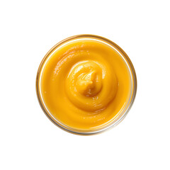 Creamy turmeric mango smoothie in a glass bowl on black background close up macro