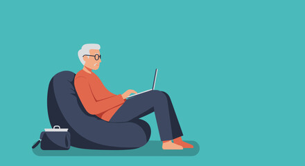 Elderly man with glasses comfortably working on a laptop from home on a beanbag chair, showcasing modern senior lifestyle and digital connectivity.