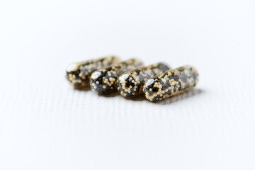 Iron capsules on bright background. Soft focus. Close up. Copy space.	