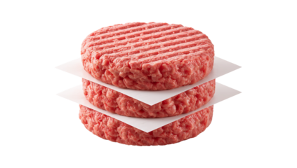 Stack of three raw burger patties on square parchment papers against a black background