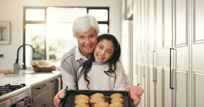 Happy grandma, grandchild or portrait with cookies for baking recipe or teamwork in kitchen. Grandmother, grandkid and smile with oven tray for dessert, culinary lesson or bonding together in house