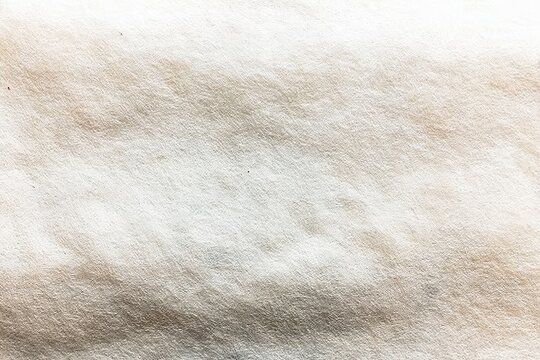 Close-up of textured, off-white fabric