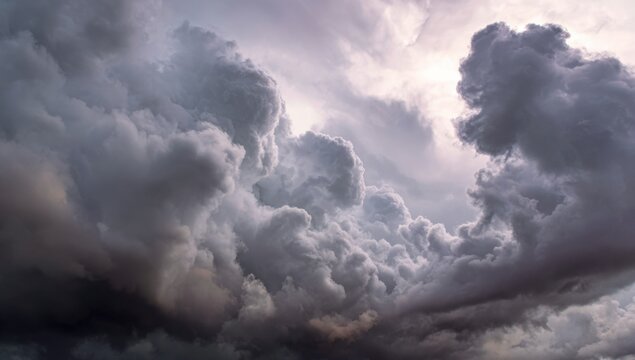 Dramatic storm clouds fill the sky - Powered by Adobe