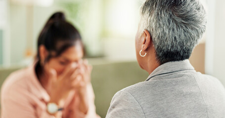 Fototapeta premium Psychologist, women and consultation with mental health, sad and trauma support in office. Back, patient crying and therapist with conversation, advice and help with ptsd, counseling and anxiety