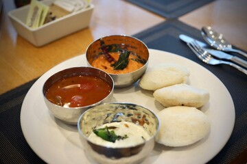 South indian breakfast food idli with sambar and chutney served 