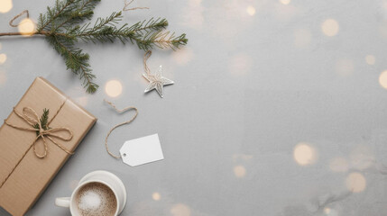 Cozy holiday scene with wrapped gift, cup of coffee, and star ornament on gray background