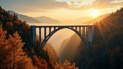 Scenic arch bridge spanning mountain valley with vibrant autumn forest and dramatic sunrise in picturesque landscape view