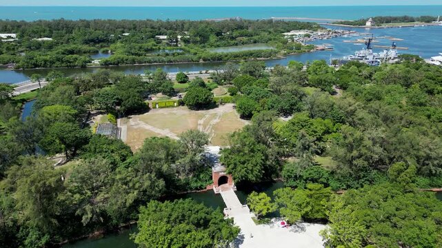 Aerial drone view of the historic Eternal Golden Castle (Erkunshun Fortress) and moat, with the Anping Harbor cityscape in summer. Tainan, Taiwan. Chinese translation : Yi Tzai Golden Castle