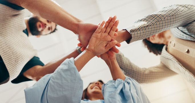 Hands, stack and team at office with low angle, support or synergy with goals in circle at startup. People, group and huddle at workplace for celebration, success or collaboration at creative agency - Powered by Adobe