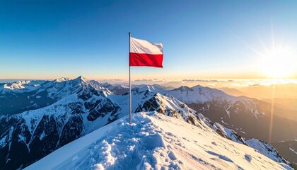 Polish flag waving majestically on a snow-capped mountain peak at sunrise