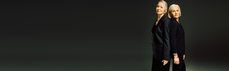 Mature women in elegant fashion celebrate love and connection in a stunning pose