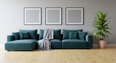 Modern living room with a large teal sectional sofa, throw blanket, and three empty picture frames on a light gray wall