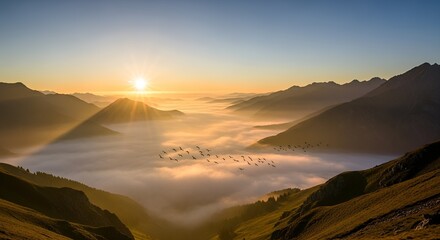 Golden sunrise over misty mountain valley.