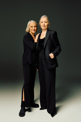 Elegant embrace of a mature couple showcasing timeless love and fashion in a chic setting