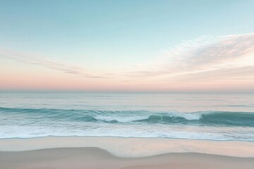 Obraz premium Calm beach waves at pastel sunset sky