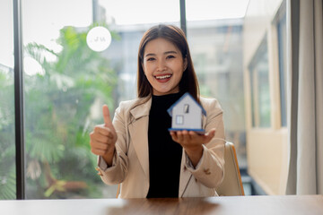 Smiling business professionals in office, embracing teamwork and leadership, celebrating success with confidence, cooperation, happiness, and positive workplace community atmosphere.
