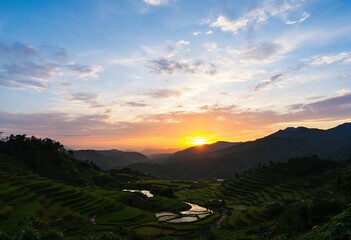 the sun is setting over the mountains and rice terraces