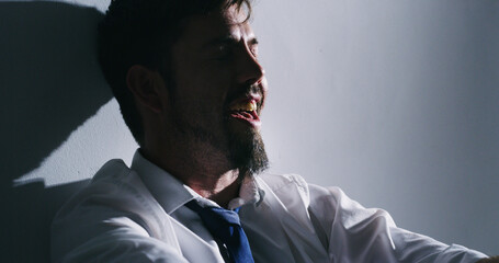 Mental health, illness and man with bipolar, manic and symptoms for mood disorder, laugh or...