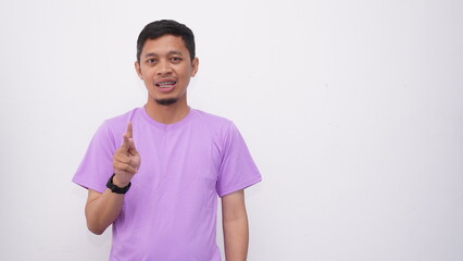 Asian Young men gesturing sign language isolated on white background © DigitalProvoke