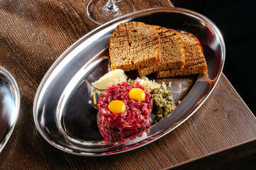 tartare with croutons and egg