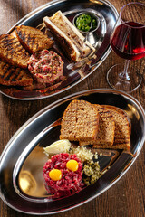 tartare with croutons and egg and tartare with a bone