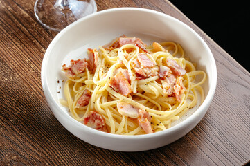 pasta carbonara on a wooden table