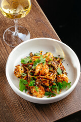 noodles in sweet and sour sauce with shrimp and sesame