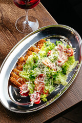 Caesar salad with breaded chicken