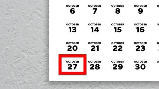 The date October 27th marked with a red cursor on the wall calendar 2025