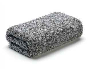 A soft, folded, gray towel on a white surface, casting a subtle shadow. The towel has a textured, plush appearance, suggesting softness and absorbency