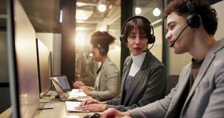 Collaboration, computer and help with business people in call center for late night assistance. Conversation, pointing and support with employee team in customer service office for evening feedback - Powered by Adobe